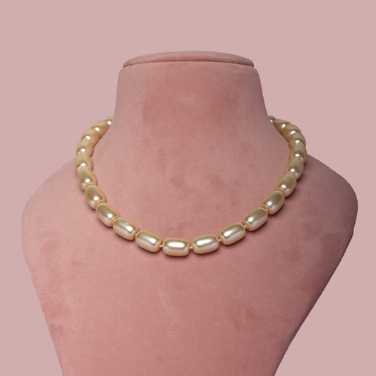Gold Barrel Pearl Necklace on Neck