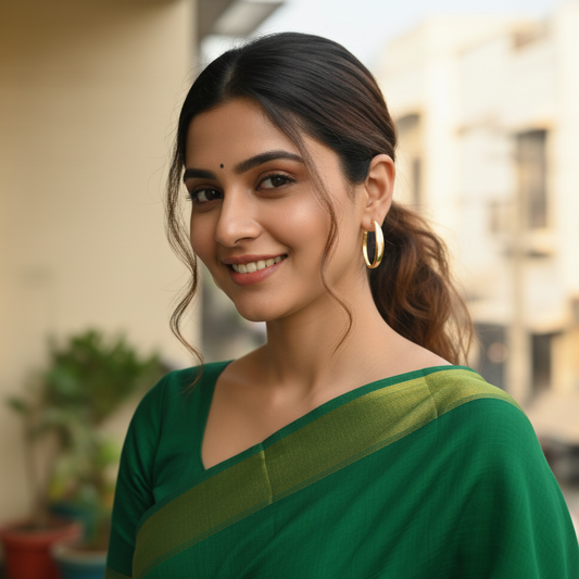 Woman wearing a green saree with a blurred background