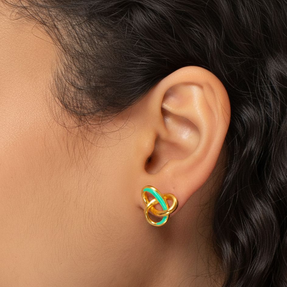 A Girl wearing love loop green earrings